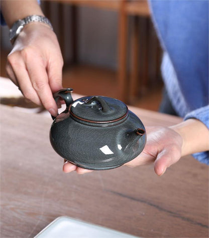 Translucent glass-like glaze teapot achieving jade-like luminosity through reduction firing