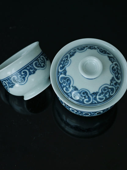 Qing Dynasty-inspired gaiwan set with ruyi cloud motifs symbolizing authority and good fortune, crafted using traditional Jingdezhen techniques and materials