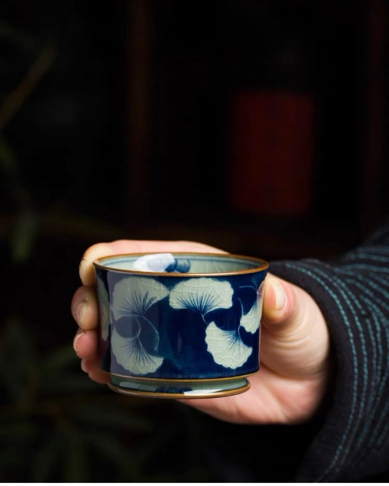 Artisan‑crafted underglaze‑blue teacup, delicate ginkgo leaf hand‑painting