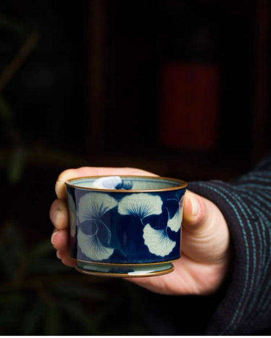 Artisan‑crafted underglaze‑blue teacup, delicate ginkgo leaf hand‑painting