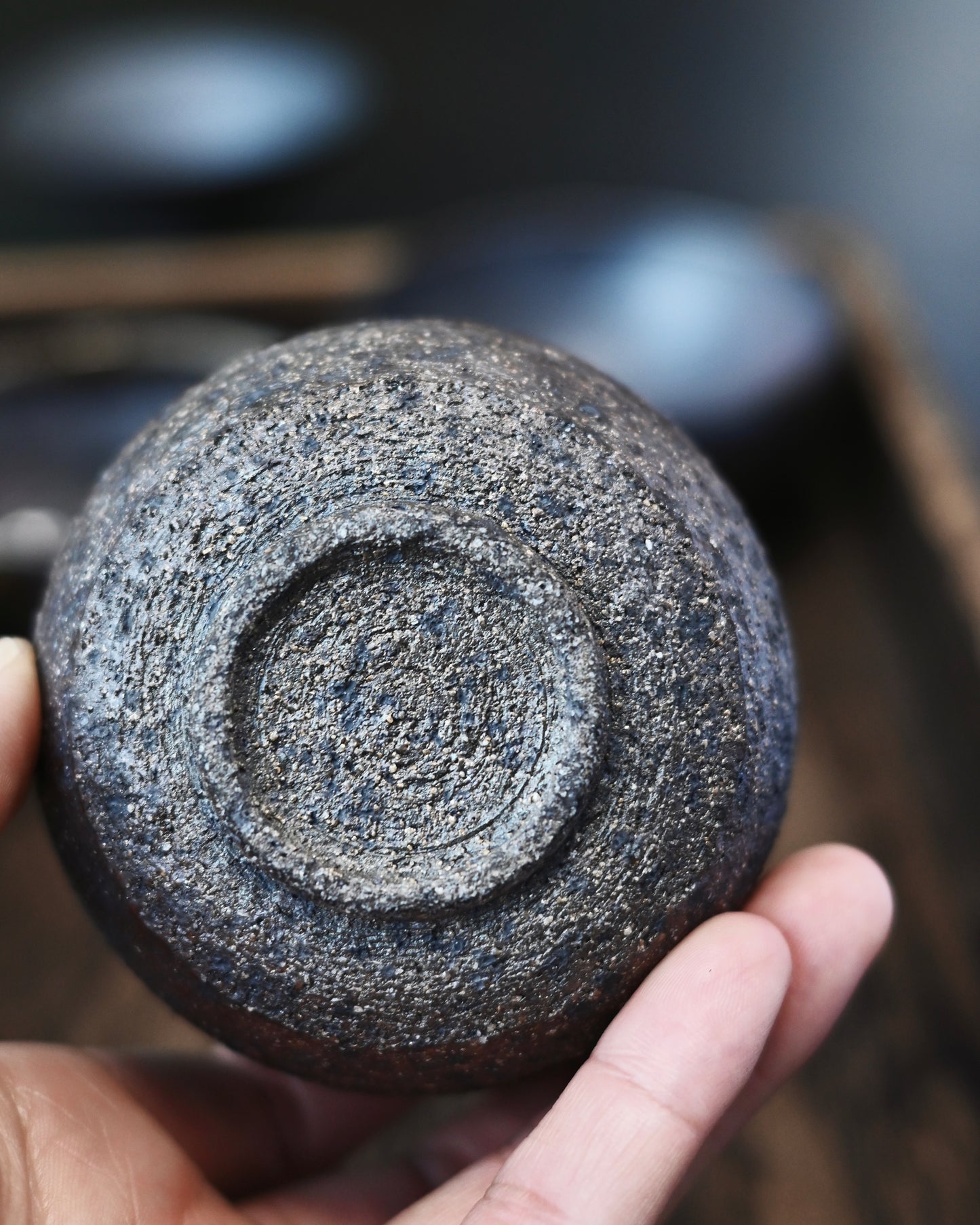 Unglazed coarse clay surface with distinct granular texture and earthy appearance