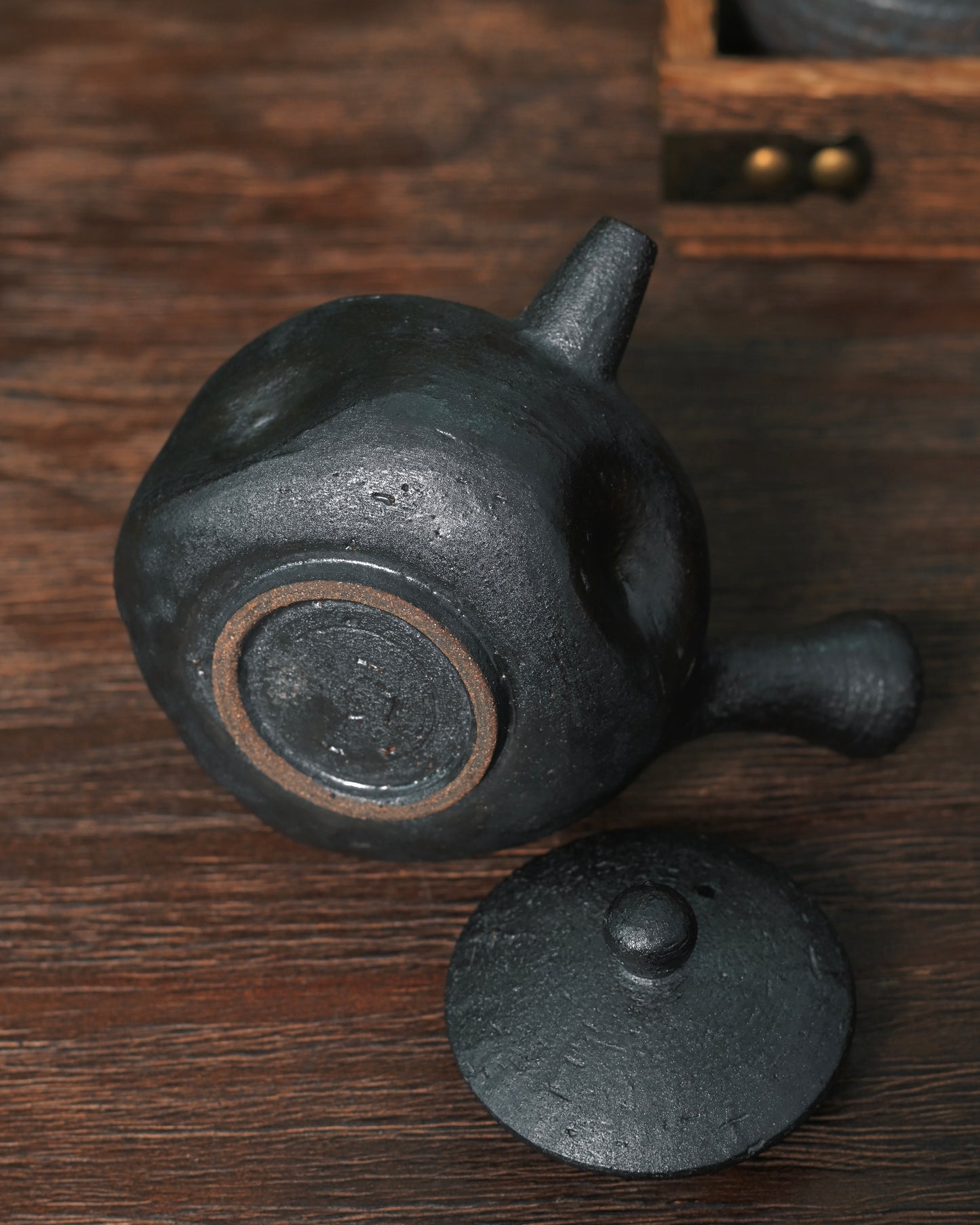 Unglazed natural clay finish preserving raw material texture and breathable quality