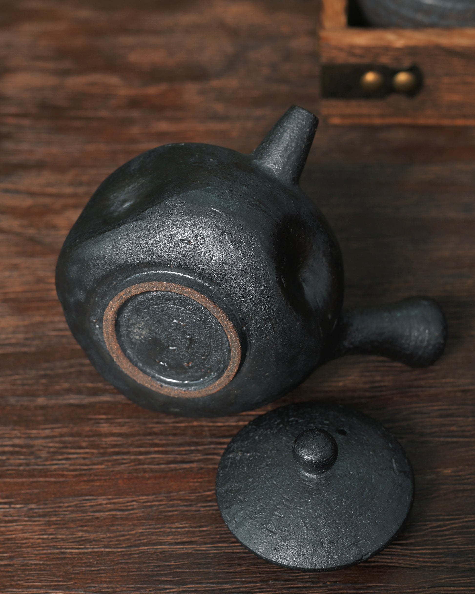 Unglazed natural clay finish preserving raw material texture and breathable quality