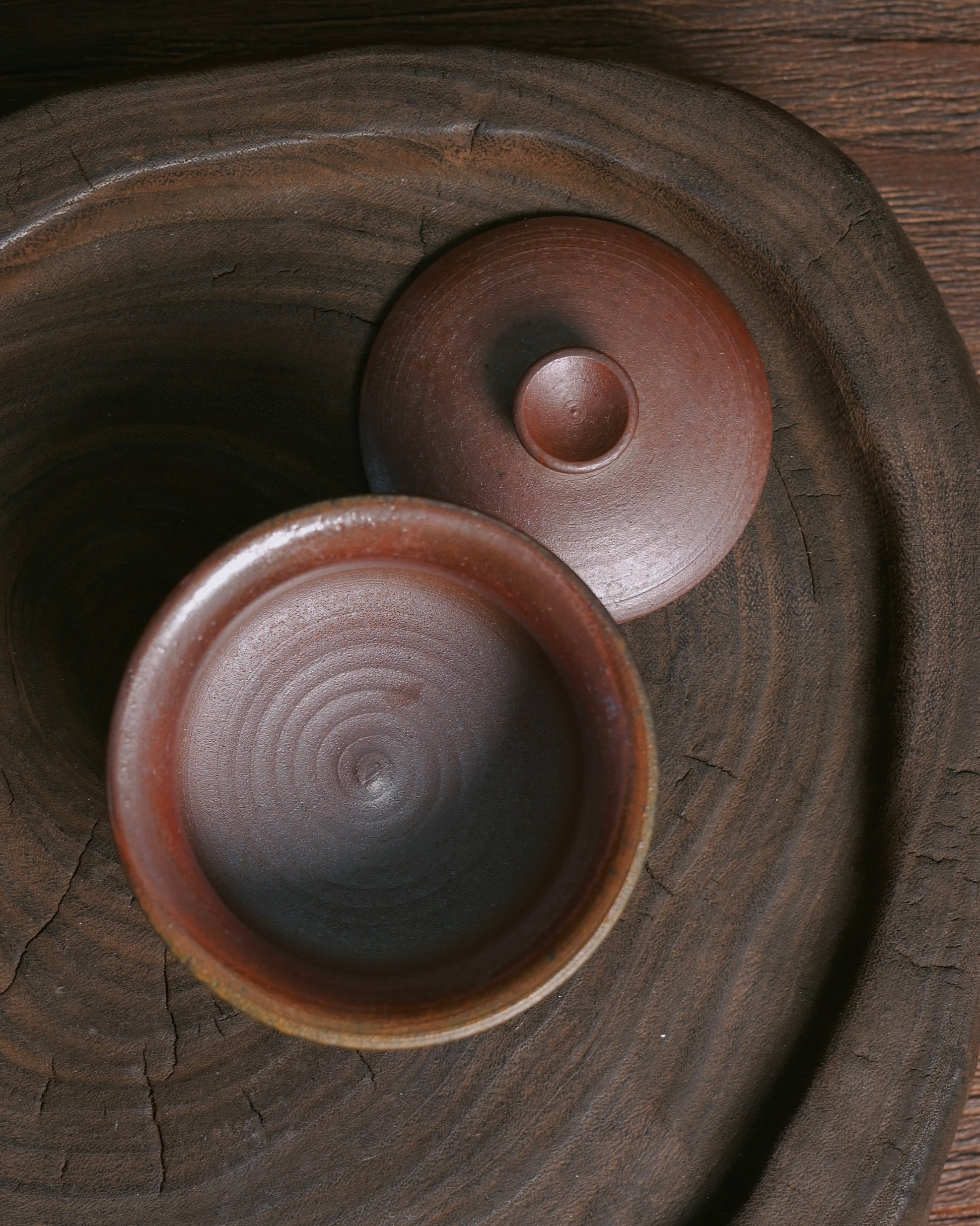 Uniform dark red glaze naturally developed through wood kiln reduction firing process