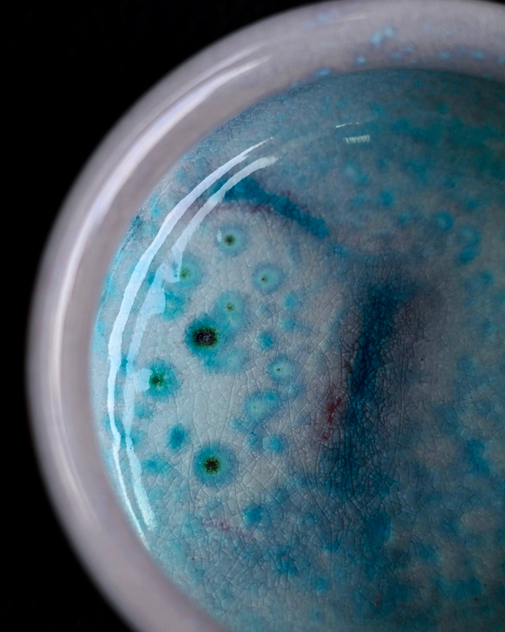 Unique glaze pattern on lidded bowl demonstrating how each soda fired piece is completely individual