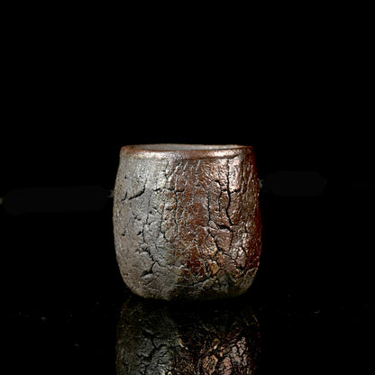 Unique handcrafted Wabi-Sabi wood-fired teacup 110ml with organic bark texture on wooden background