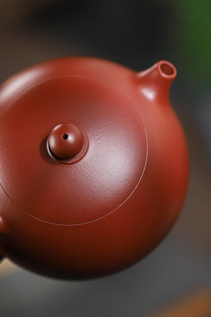Timeless Xishi teapot - a Top 10 traditional form - masterfully executed in dahongpao clay with hydrodynamic pouring and Song Dynasty-inspired curves.