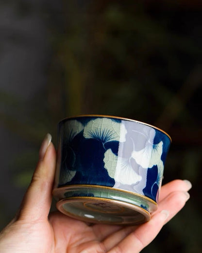 Vintage‑form Chinese teacup featuring elegant hand‑drawn ginkgo foliage