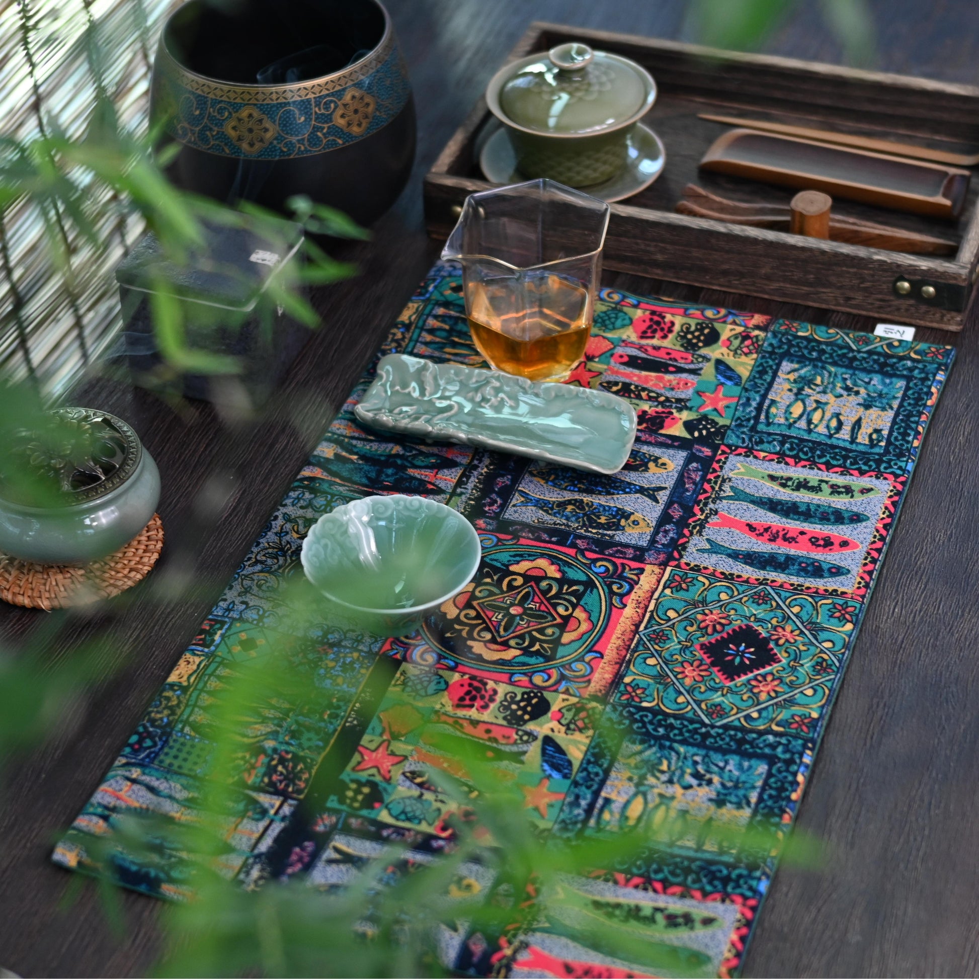 Traditional fish pattern tea mat symbolizing abundance, crafted from absorbent cotton-linen for practical yet decorative table use.