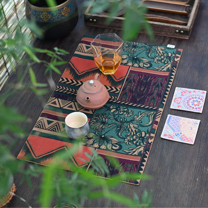 Nordic-inspired tea table accessory, cotton linen mat with vintage ethnic motifs.
