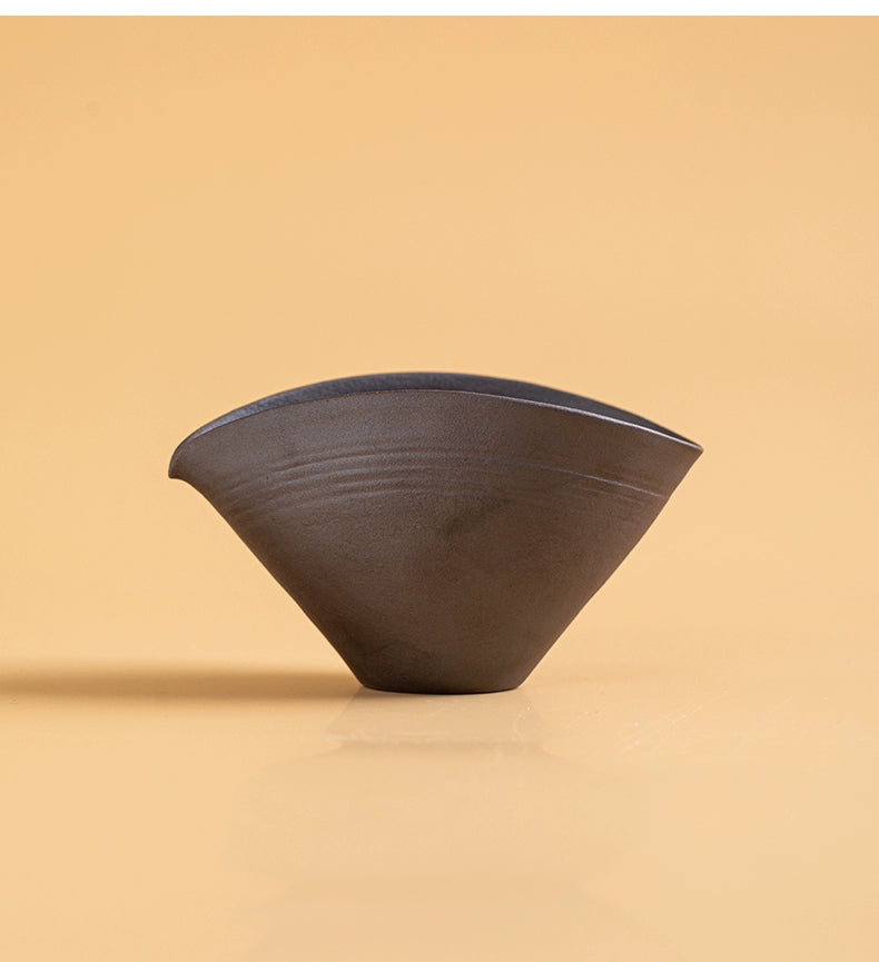 Handmade ceramic flat teapot with natural kiln tones