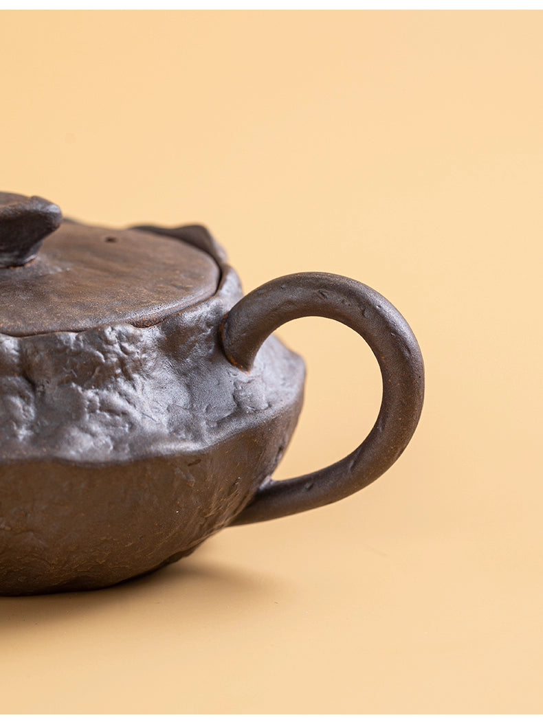 Minimalist wabi-sabi wood-fired teapot on table