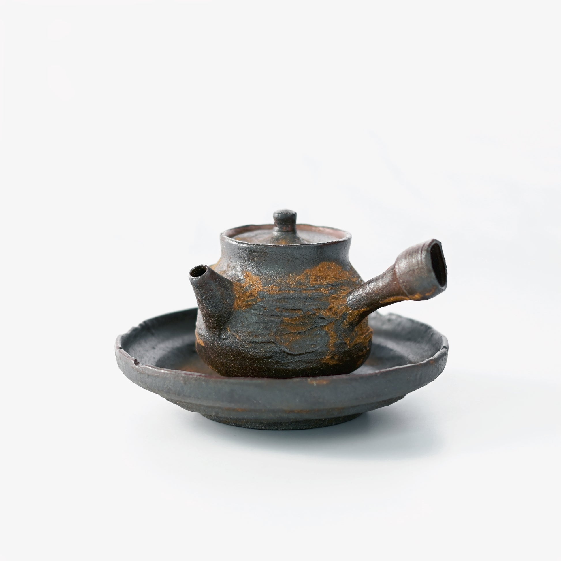 Simple tea ceremony essentials focusing on functionality and material authenticity over ornamentation