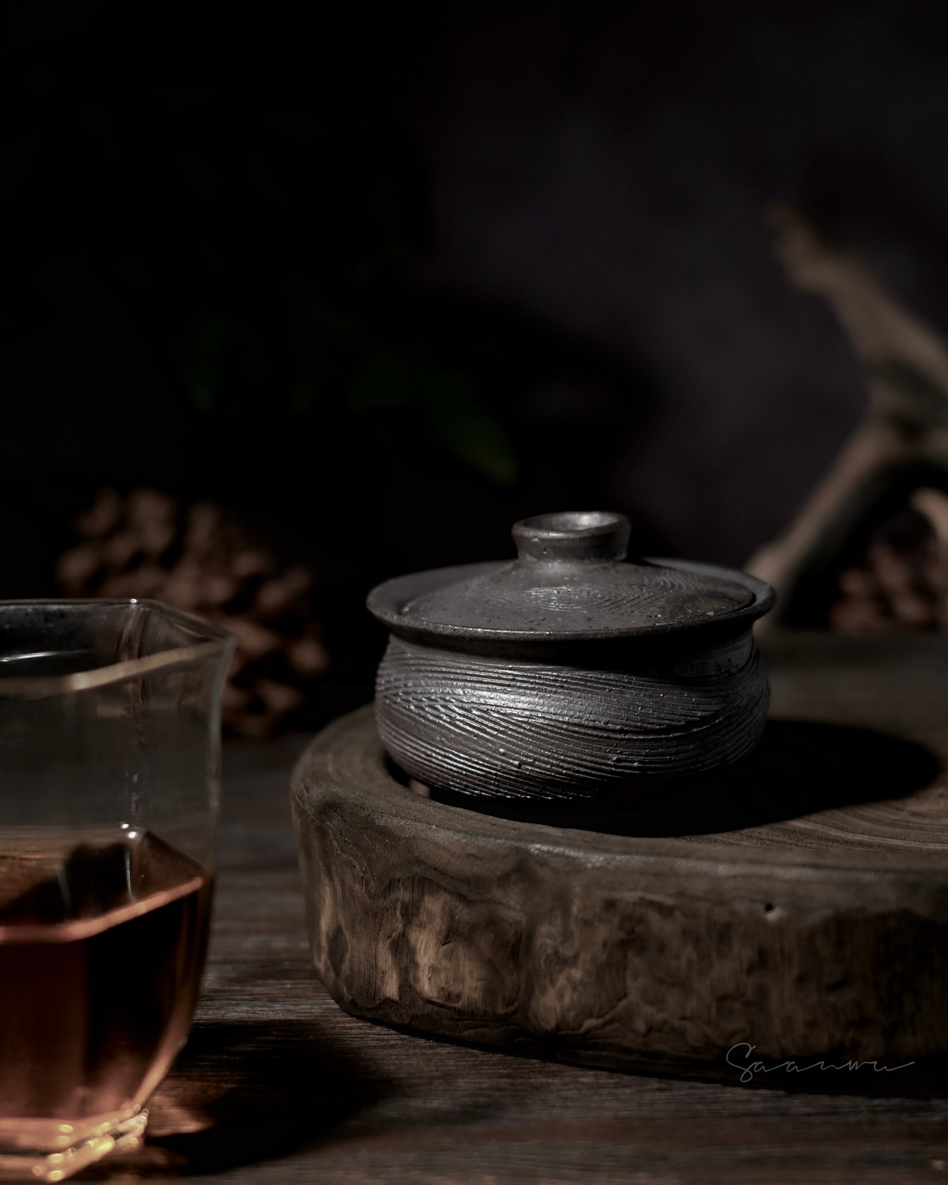 Wabi-sabi tea ceremony bowl with unrefined clay texture and visible mineral particles