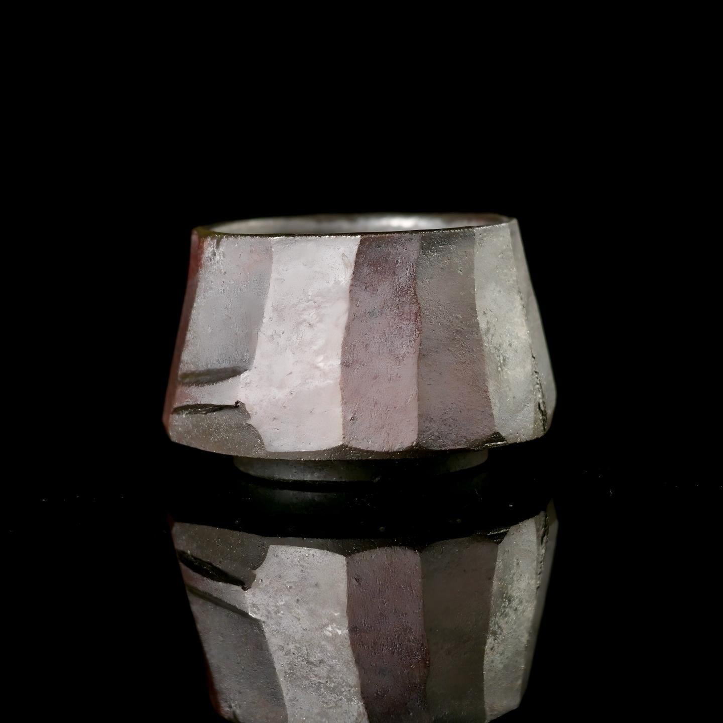 Wabi-sabi style tea cup showcasing intentional irregular form and natural clay texture