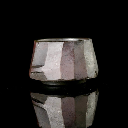 Wabi-sabi style tea cup showcasing intentional irregular form and natural clay texture