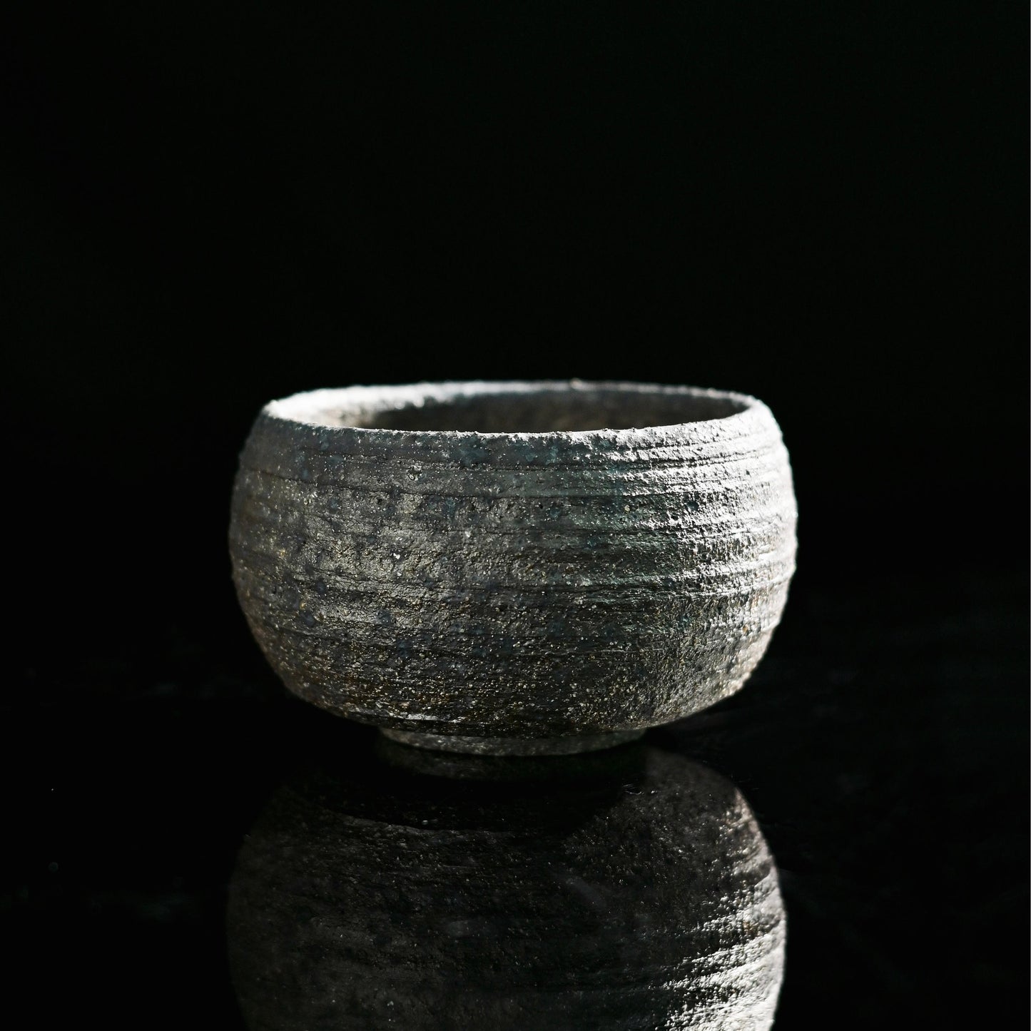 Wabi-sabi wood fired master cup showing natural clay texture and minimalist form