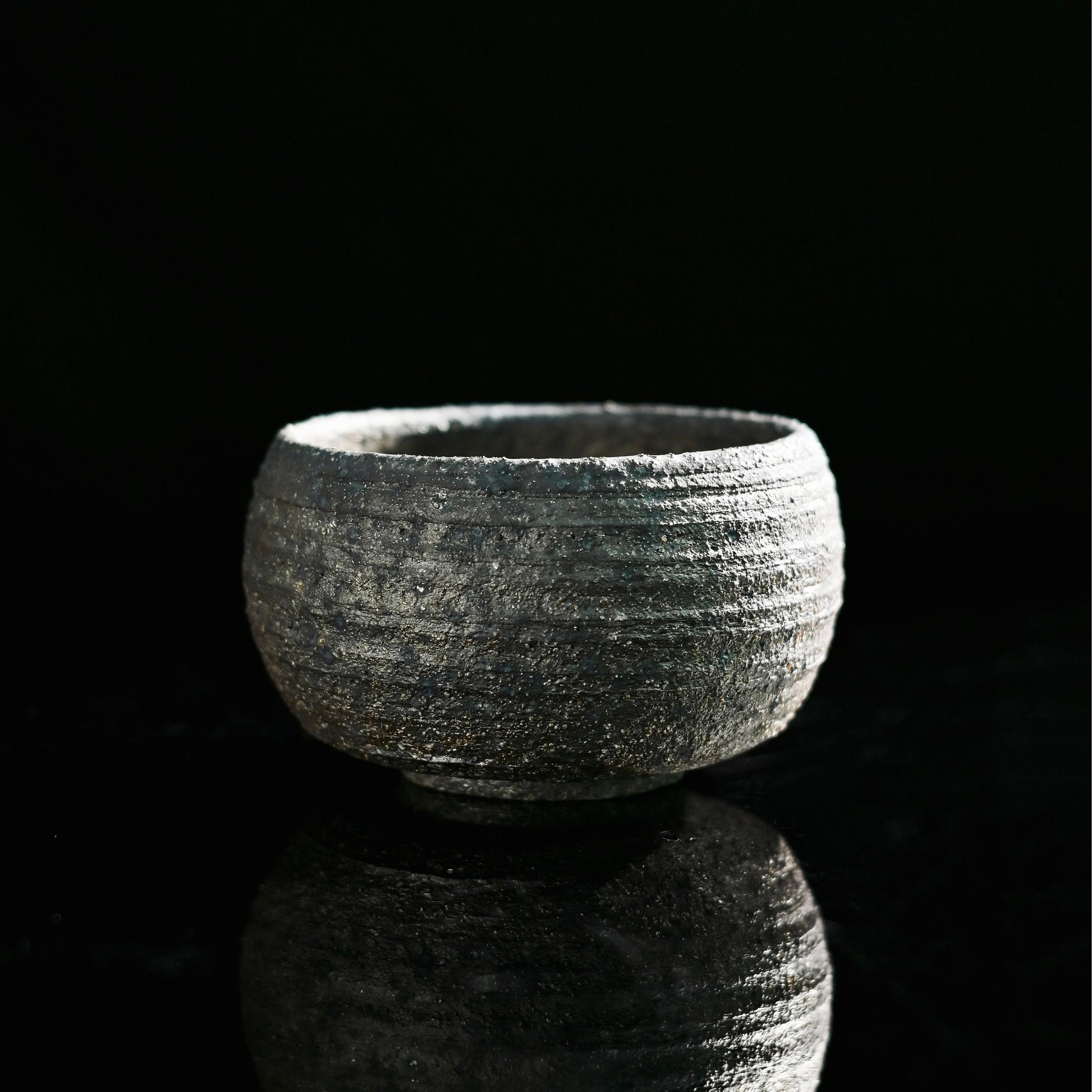 Wabi-sabi wood fired master cup showing natural clay texture and minimalist form