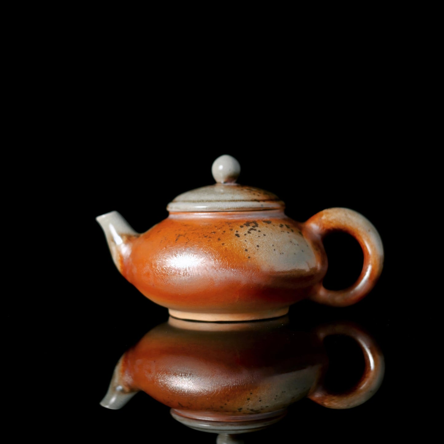 Wood-fired high-white clay teapot with natural ash glaze formed by pine embers at 1300°C