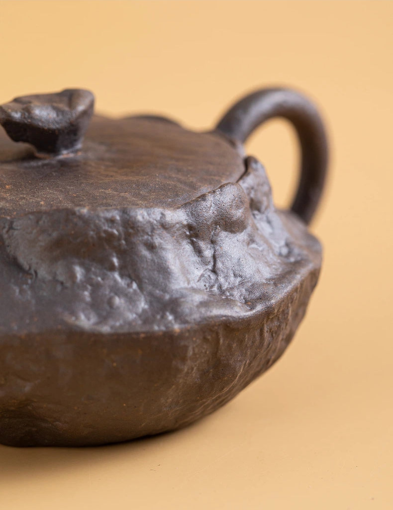 Flat teapot showing natural kiln ash patterns