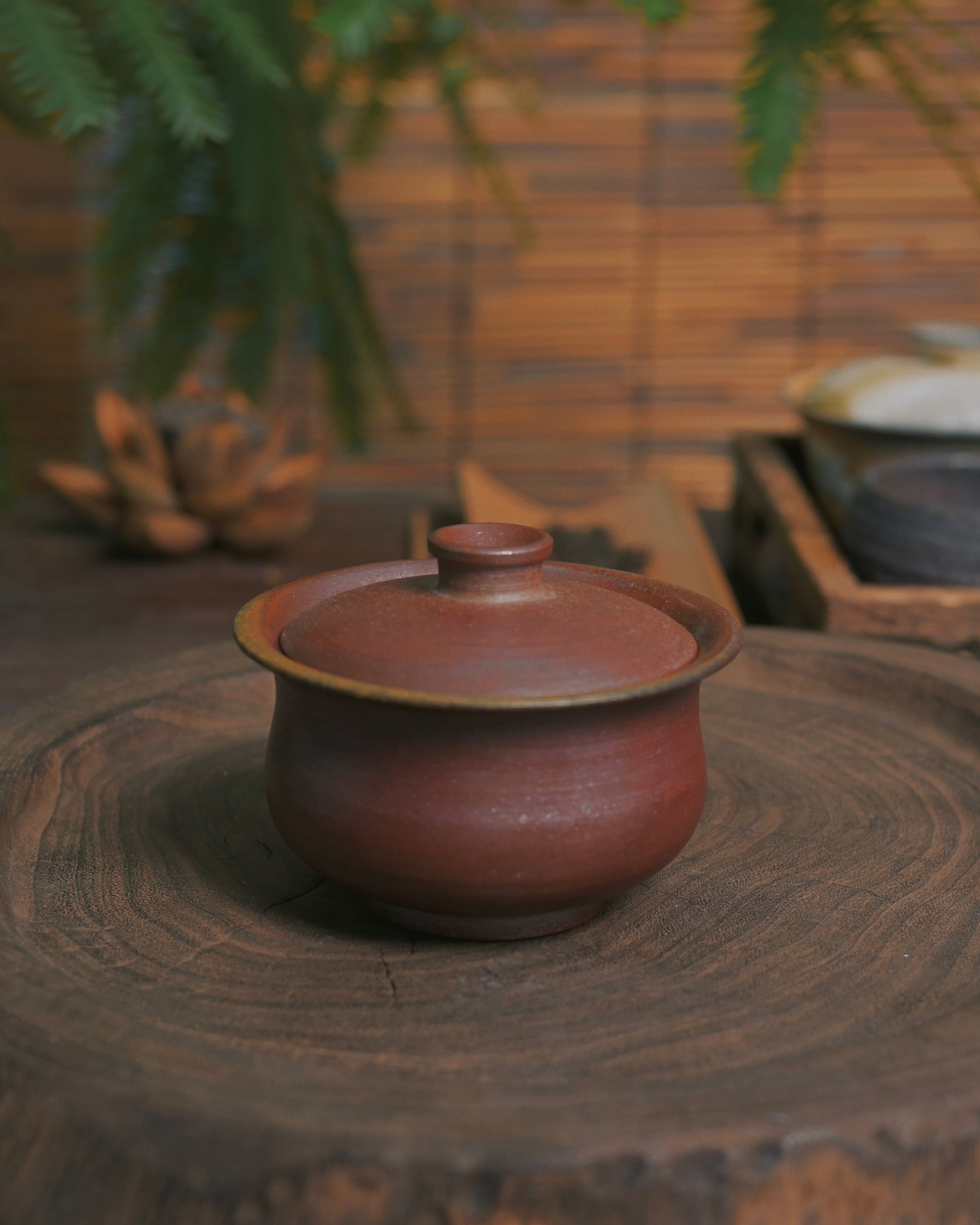 Hand-shaped tea vessel representing harmony between artisan craftsmanship and natural material response
