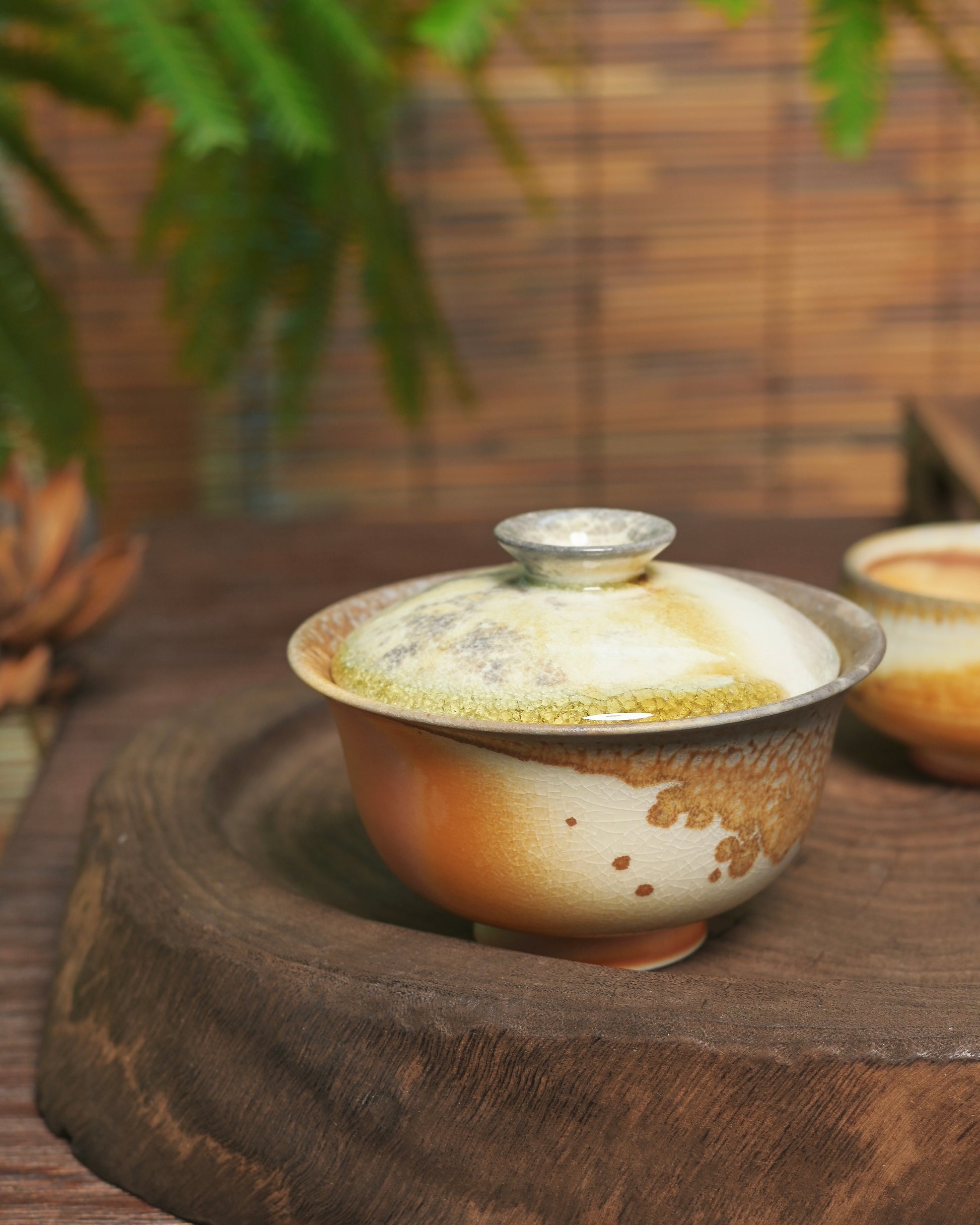 Naked firing technique allowing direct clay-flame interaction without protective glaze barrier