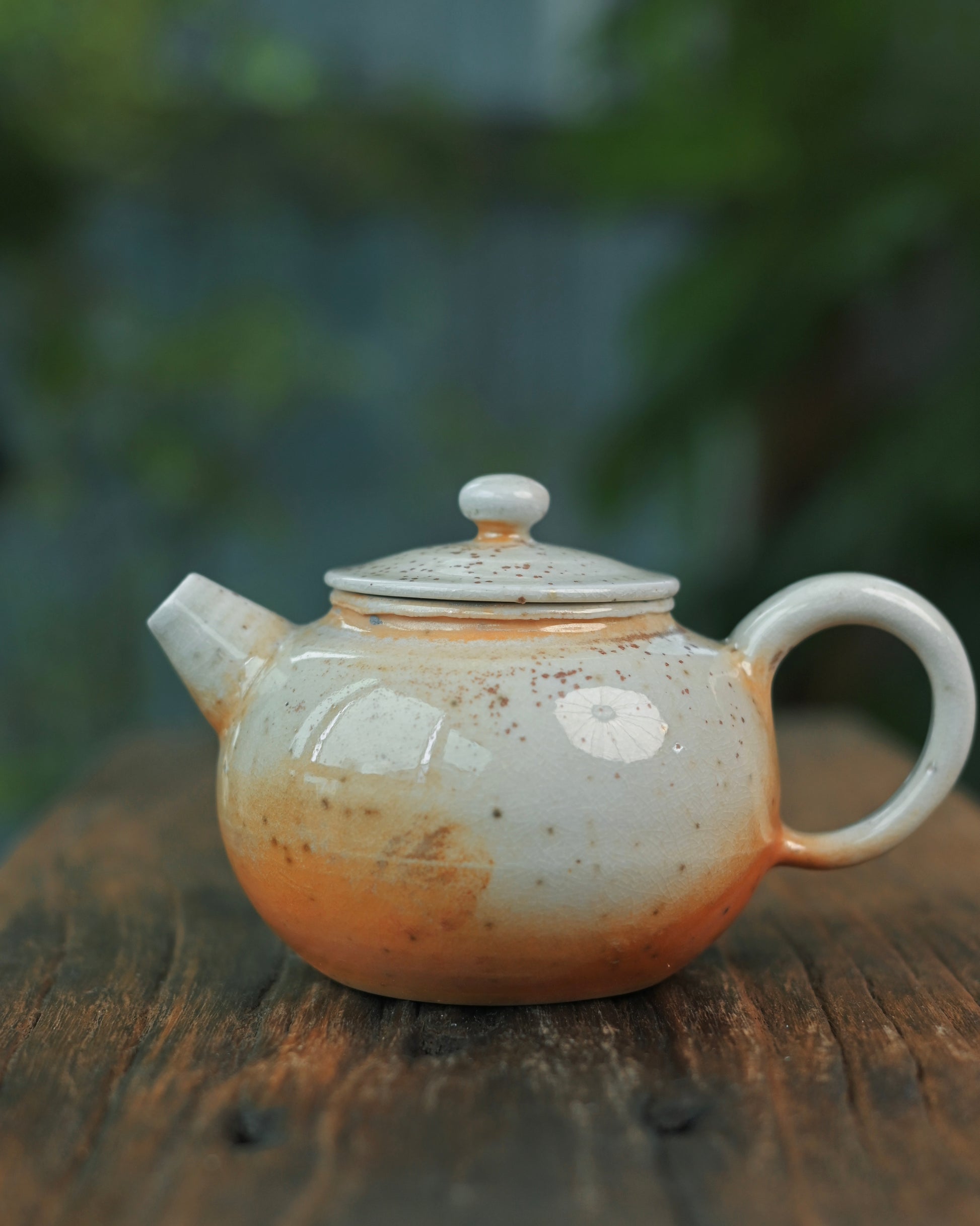 Unglazed interior surface maintaining raw clay porosity for tea aroma enhancement