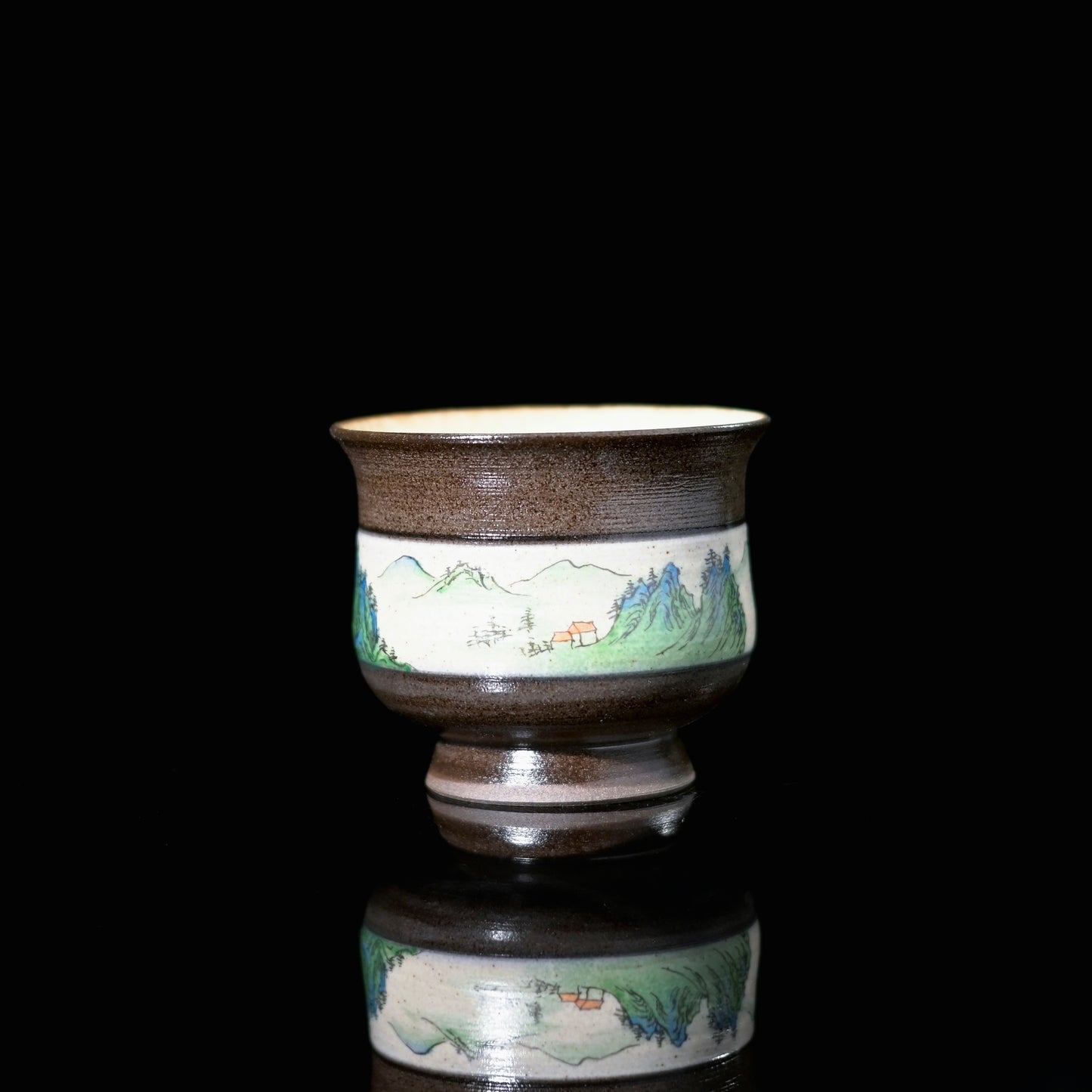 Northern Song dynasty ceramic teaware featuring layered mountain peaks and winding rivers across lid bowl and saucer
