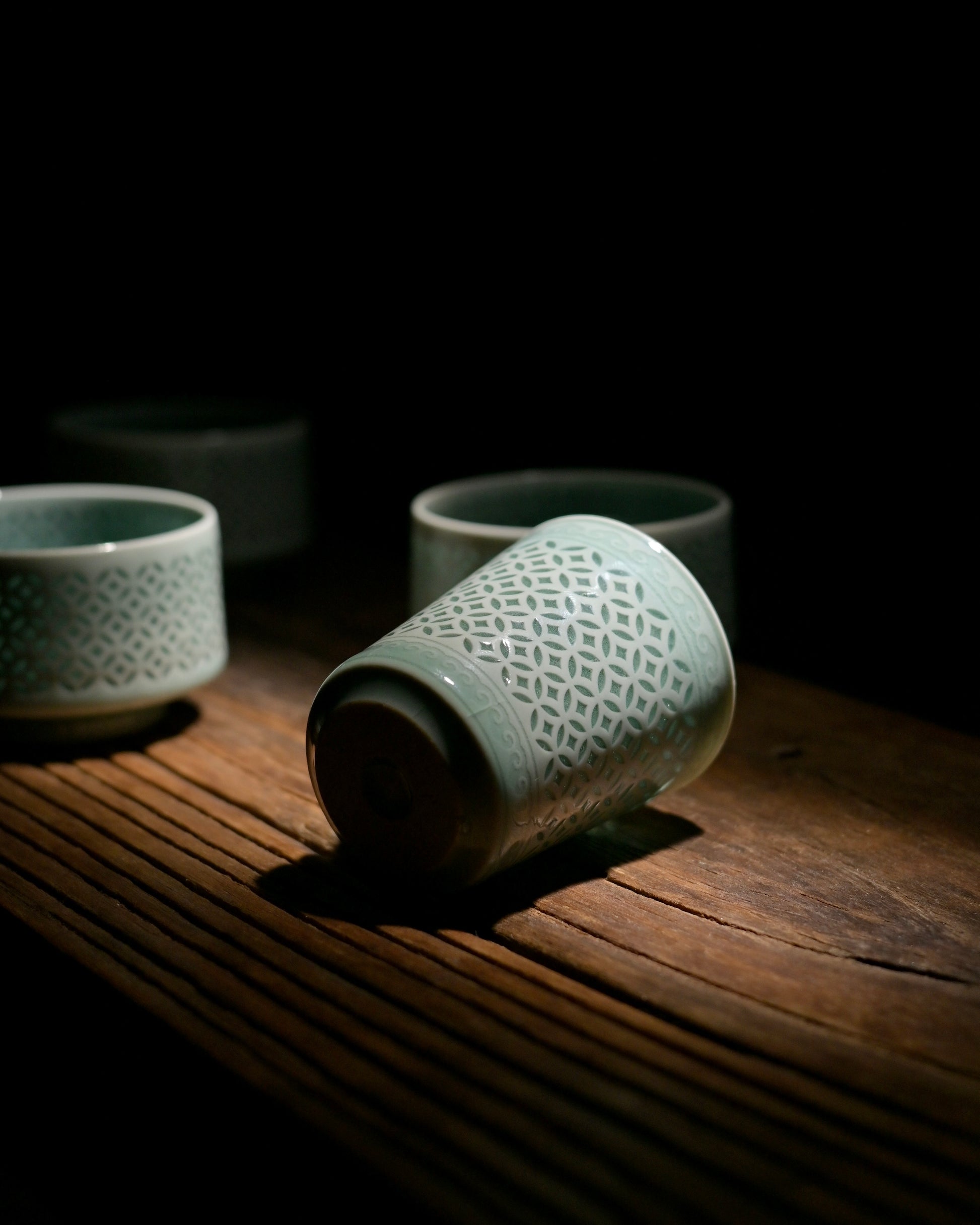 Wide mouth linglong Longquan celadon sipping cup for white tea green tea, short flat body translucent hollow ceramic teacup