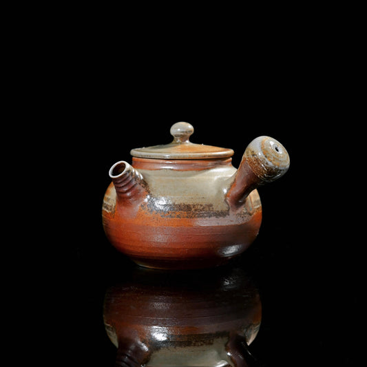Wood-fired ash glaze teapot featuring natural crystalline glaze formed by pine ash melting