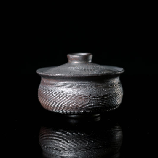 Wood-fired coarse clay lidded bowl set with hand-carved linear texture and natural ash deposits