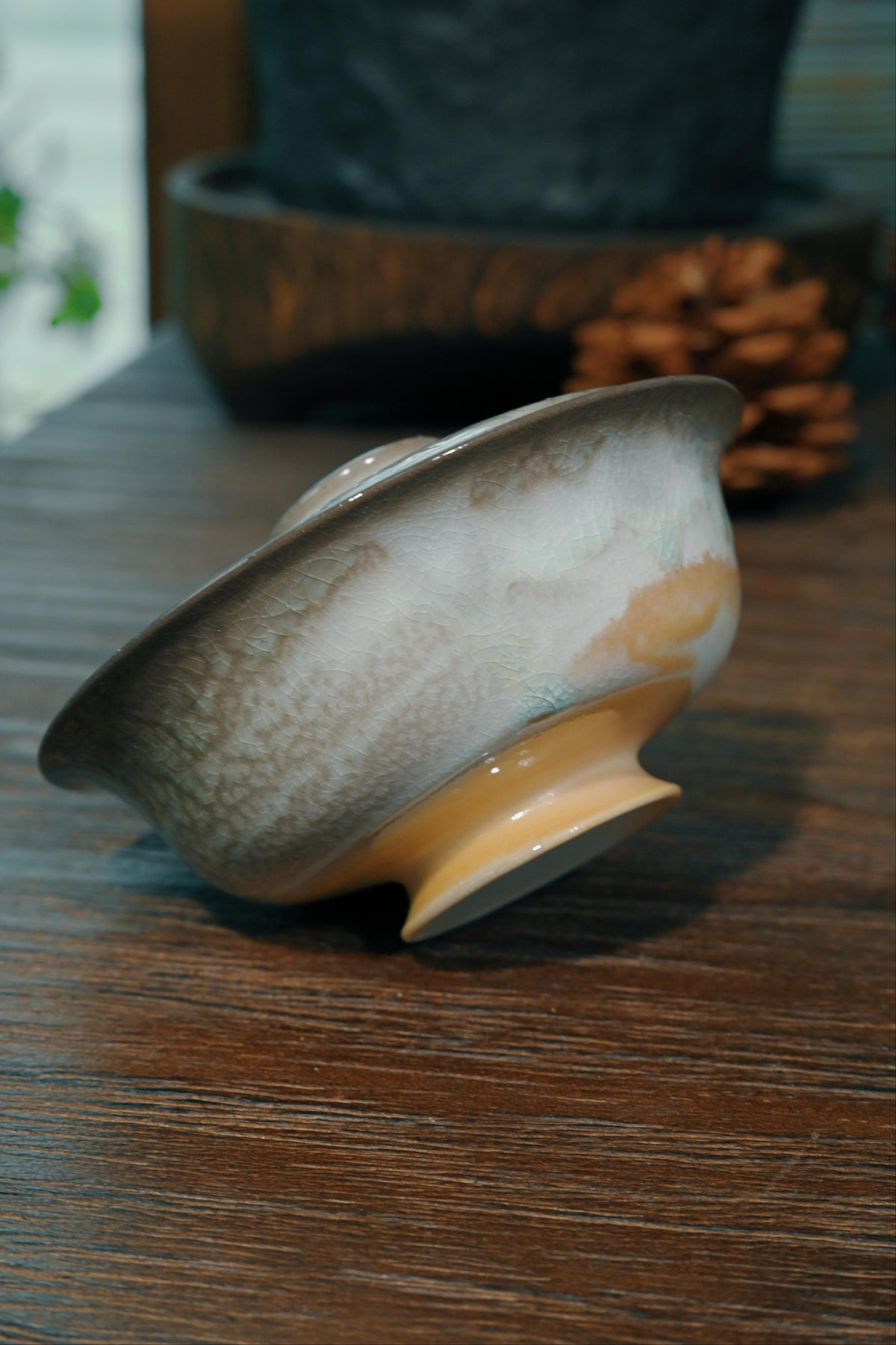 Close-up of 100ml wood-fired gaiwan wide Yuanbao lip and ring lid knob designed for precise tea pouring
