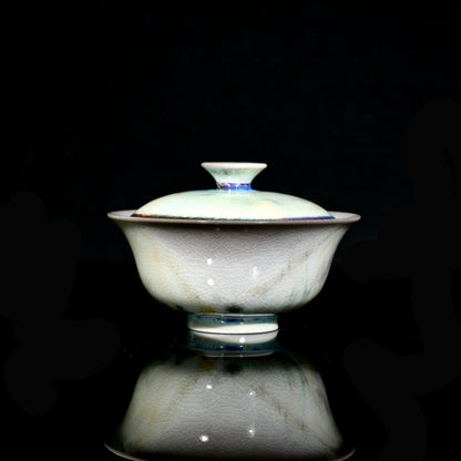 1-of-1 wood-fired 120ml gaiwan with electric cyan glaze streak and cream Yuanbao gold ingot shape