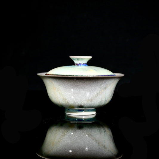 1-of-1 wood-fired 120ml gaiwan with electric cyan glaze streak and cream Yuanbao gold ingot shape