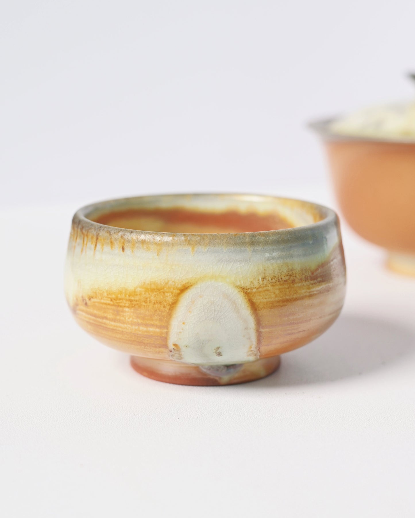 Natural crystalline glaze development from wood ash deposition during high-temperature kiln process