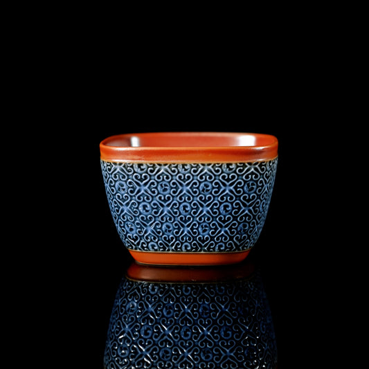 Wood-fired square master cup with smooth porcelain surface free of impurities