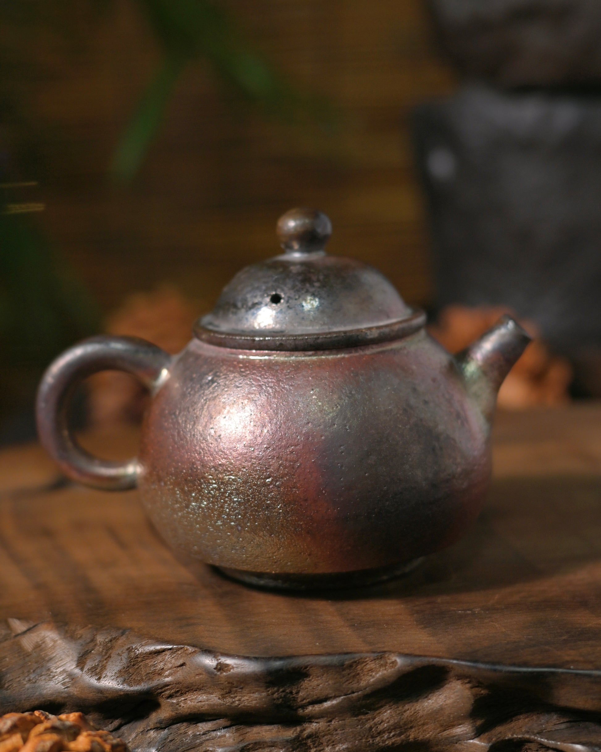 Detail of flame marks and kiln transformation on wood-fired ceramic teapot