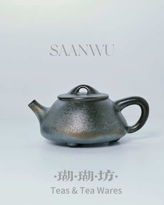 Kiln-transformed Shi Piao form showing natural mineral colors developed through wood-firing process