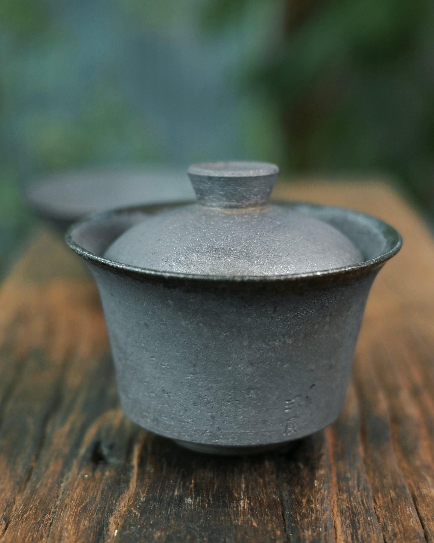 Unglazed clay surface revealing raw texture and micro-porosity of natural clay material