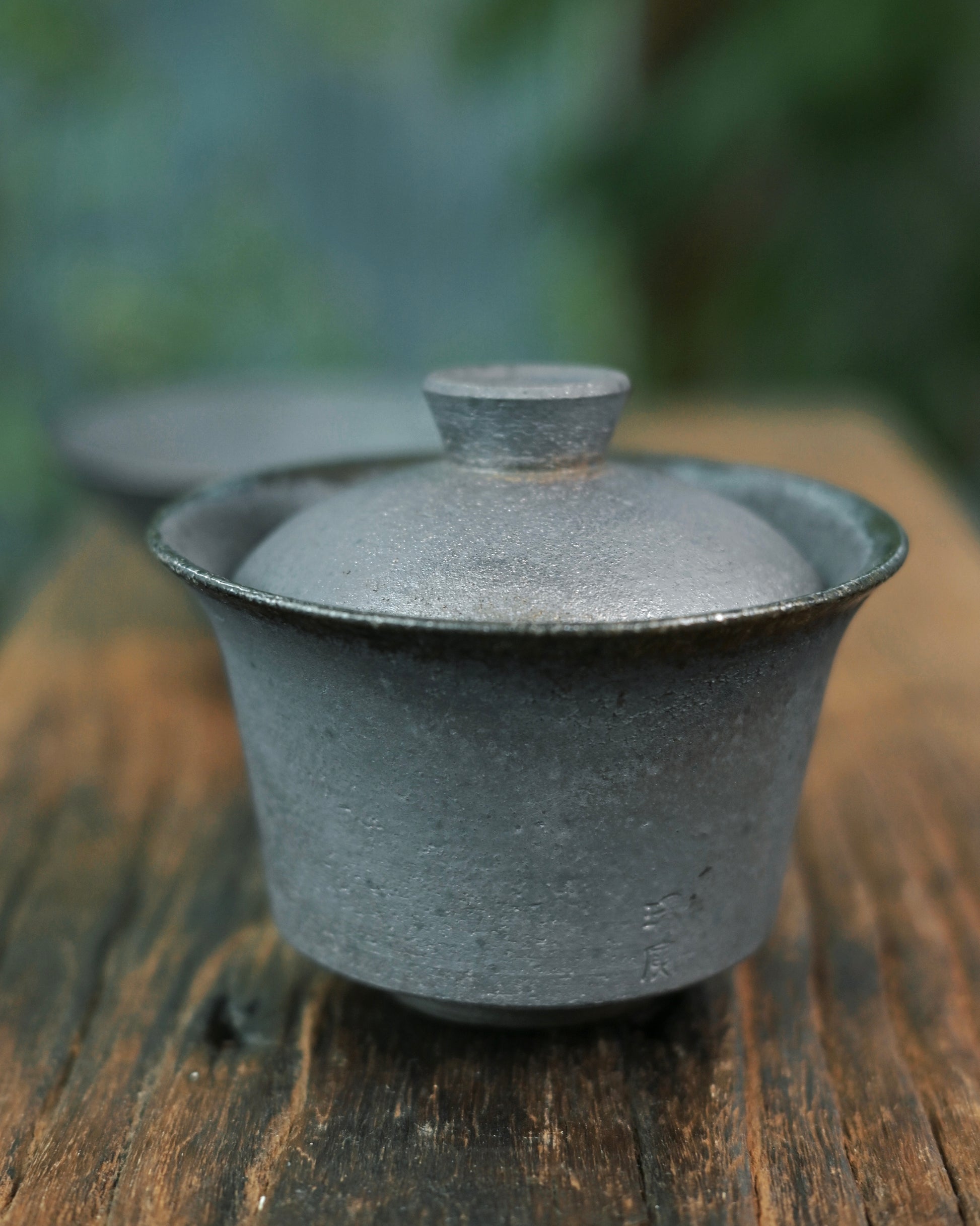 Unglazed clay surface revealing raw texture and micro-porosity of natural clay material