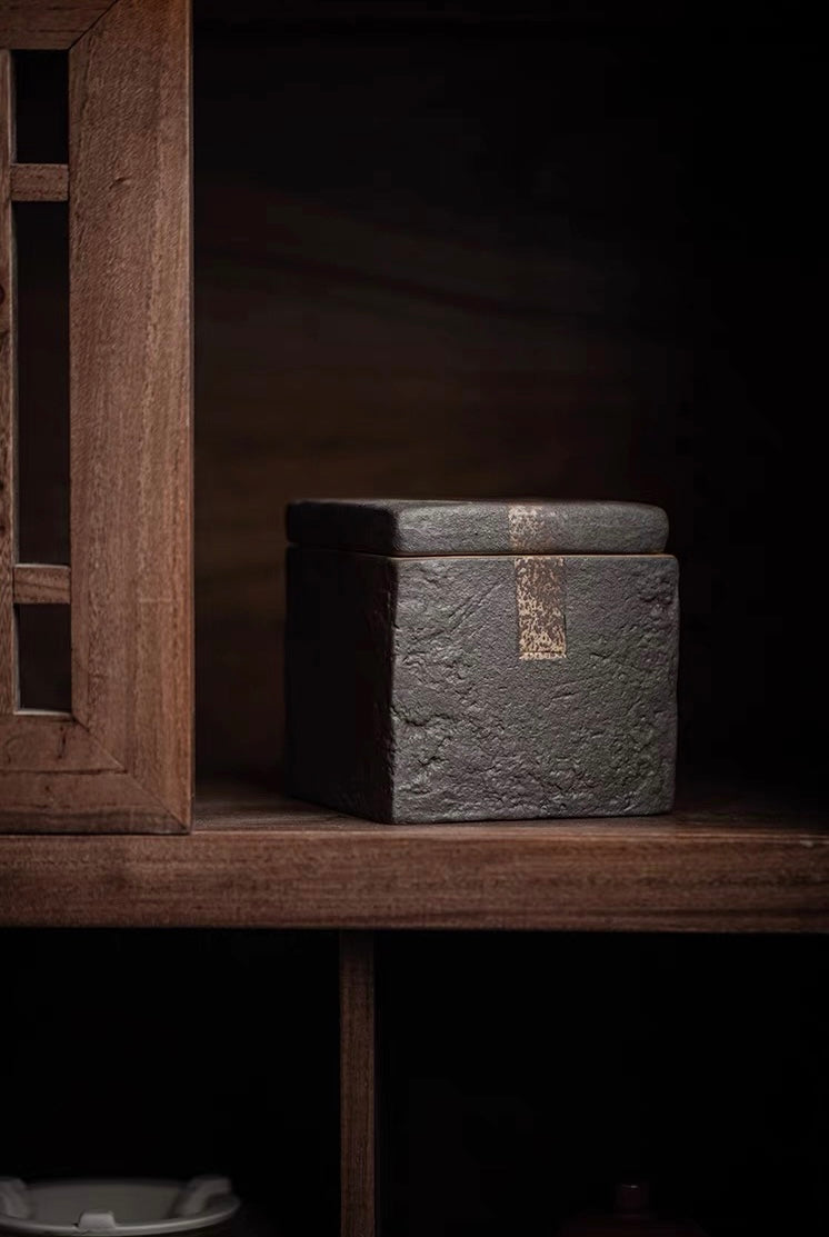 Wood-fired coarse clay tea jar with square shape and intentionally rough unglazed surface