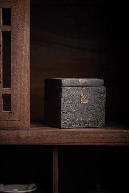 Wood-fired coarse clay tea jar with square shape and intentionally rough unglazed surface