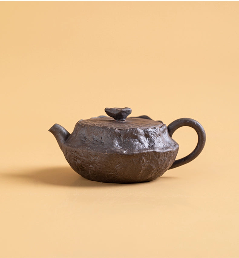Artisan flat teapot with natural wood-fired ash glaze