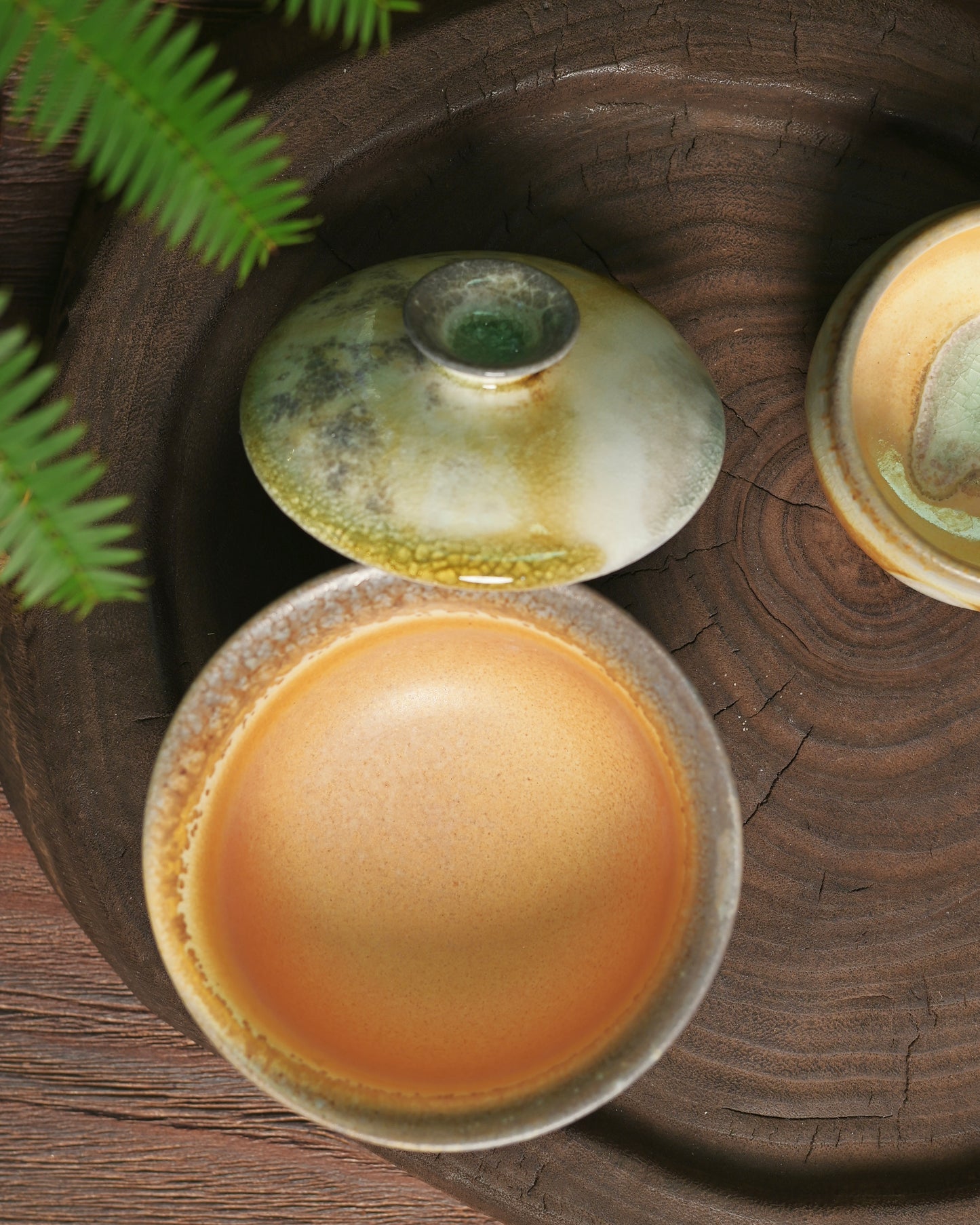 Crimson fire markings on unglazed surfaces demonstrating wood kiln flame patterns