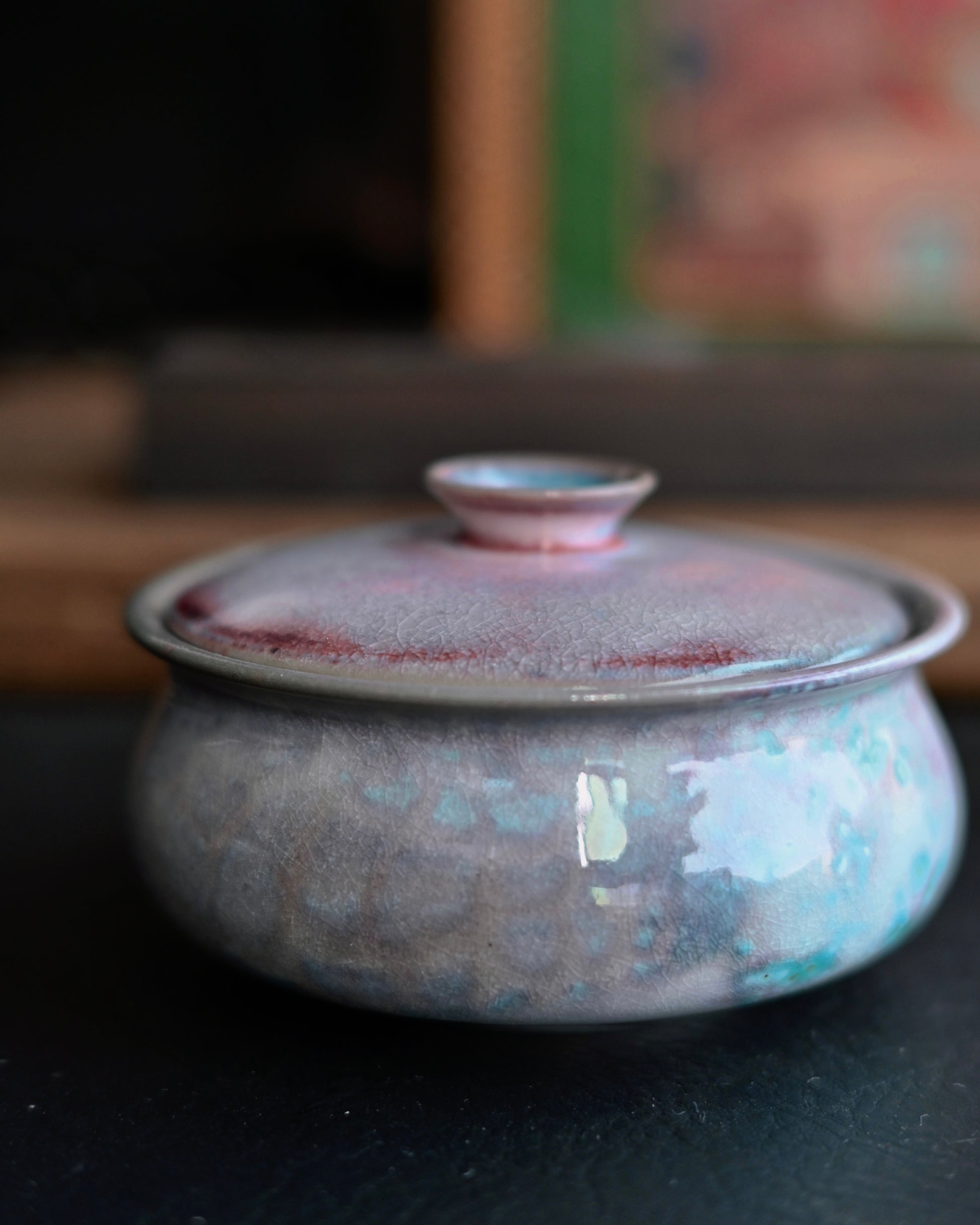 Ceramic bowl during wood firing process where soda ash interacts with clay minerals at high temperature