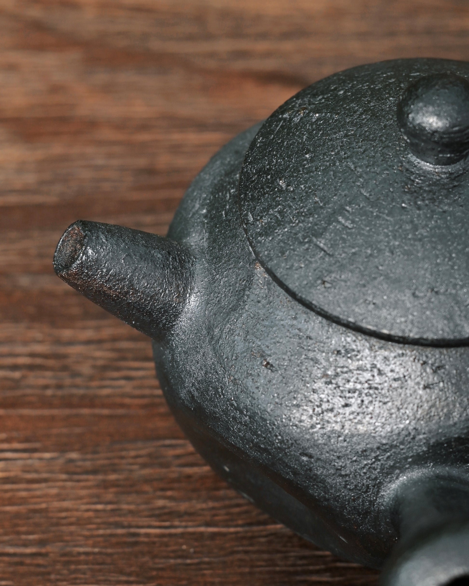 Wood kiln reduction firing process developing deep charcoal coloring without glaze