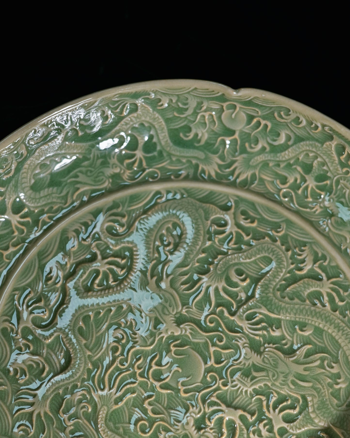 Yaozhou Ware olive-green glazed platter contrasting with southern Longquan plum-green celadon
