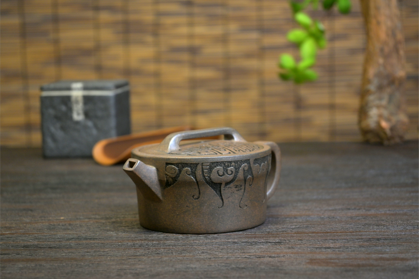 Rustic Yixing Duan clay teapot with subdued colors and graceful lines, representing traditional wood-fired craftsmanship