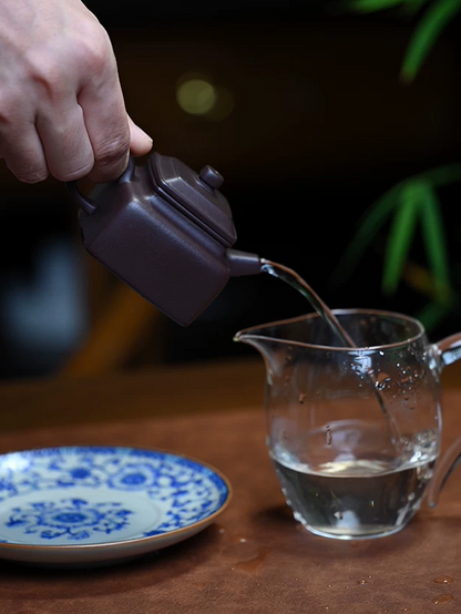 Original ore Zini teaware with warm purple-brown tone developing patina through regular tea use