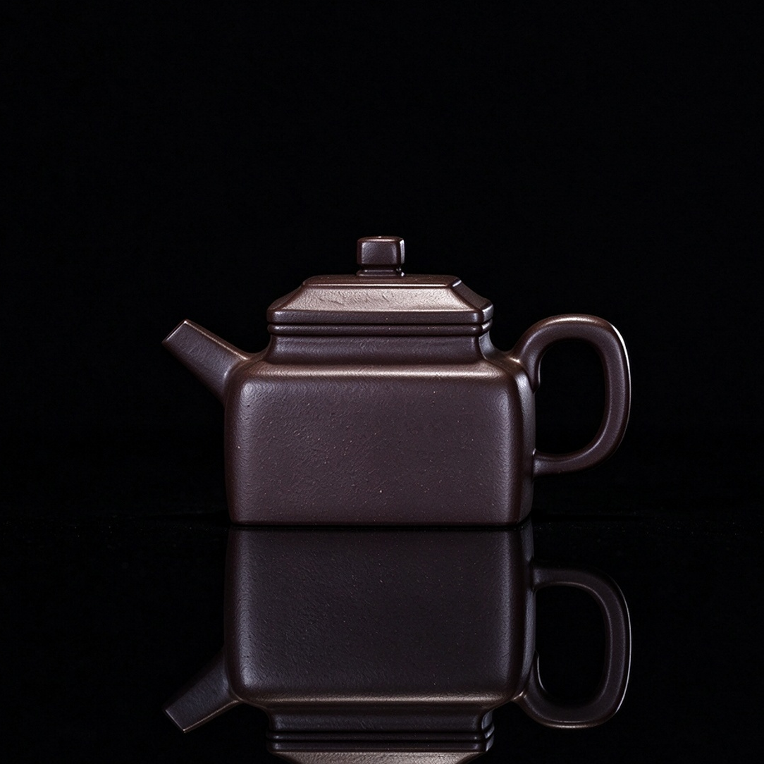 Yixing original ore Zini square teapot with 130ml capacity and handmade construction from Huanglong Mountain clay